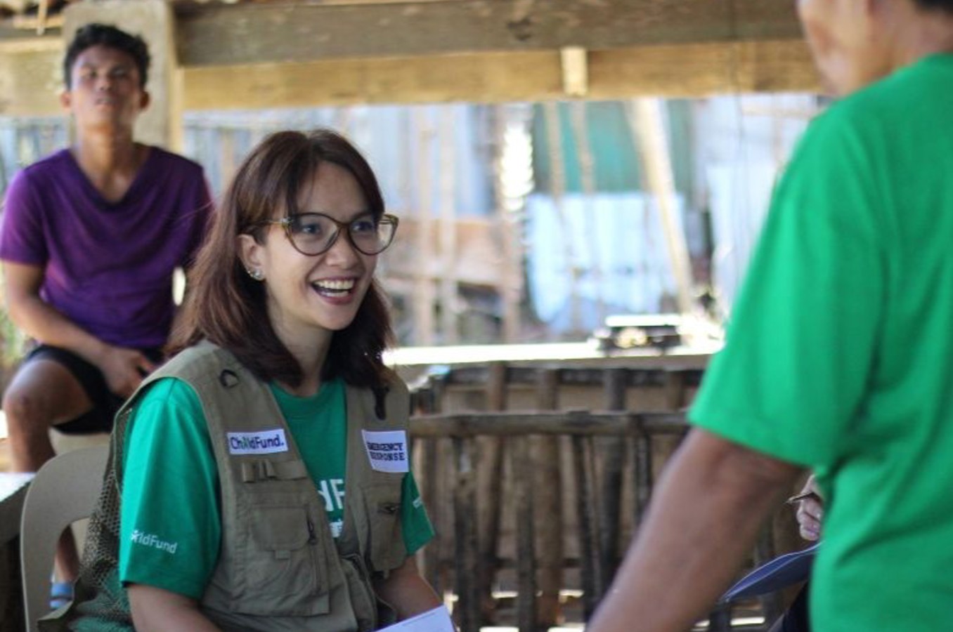 ChildFund aid worker hands out supplies